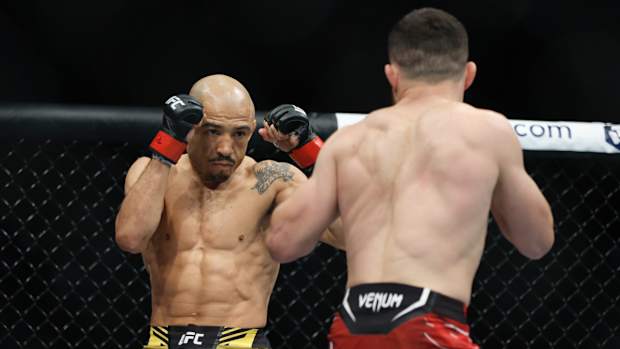 Aug 20, 2022; Salt Lake City, Utah, USA; Jose Aldo (red gloves) fights Merab Dvalishvili (blue gloves) during UFC 278 at Vivint Arena. Mandatory Credit: Jeffrey Swinger-USA TODAY Sports